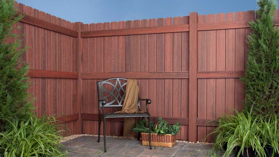 Brown privacy fencing in a garden courtyard, shown as an application reference